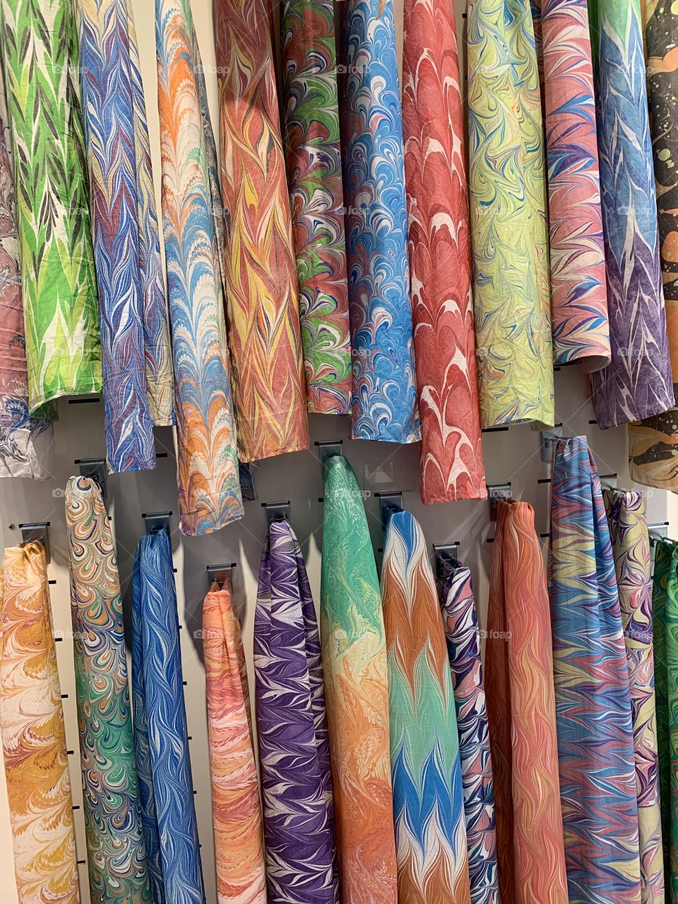 Colorful batik fabric samples with designs and patterns