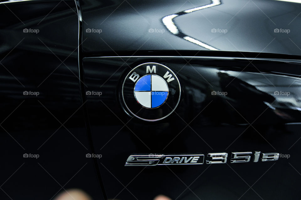 BMW car with Logo in a Carshop.