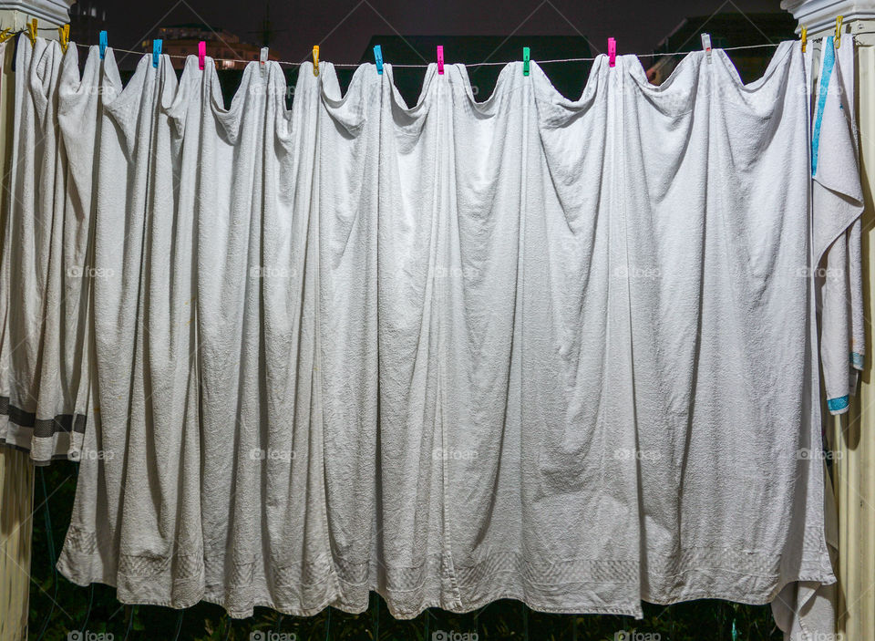 view of the household, white towels dries on ropes on clothespins