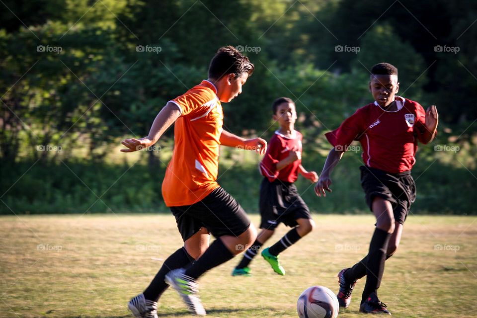 Kids are playing soccer