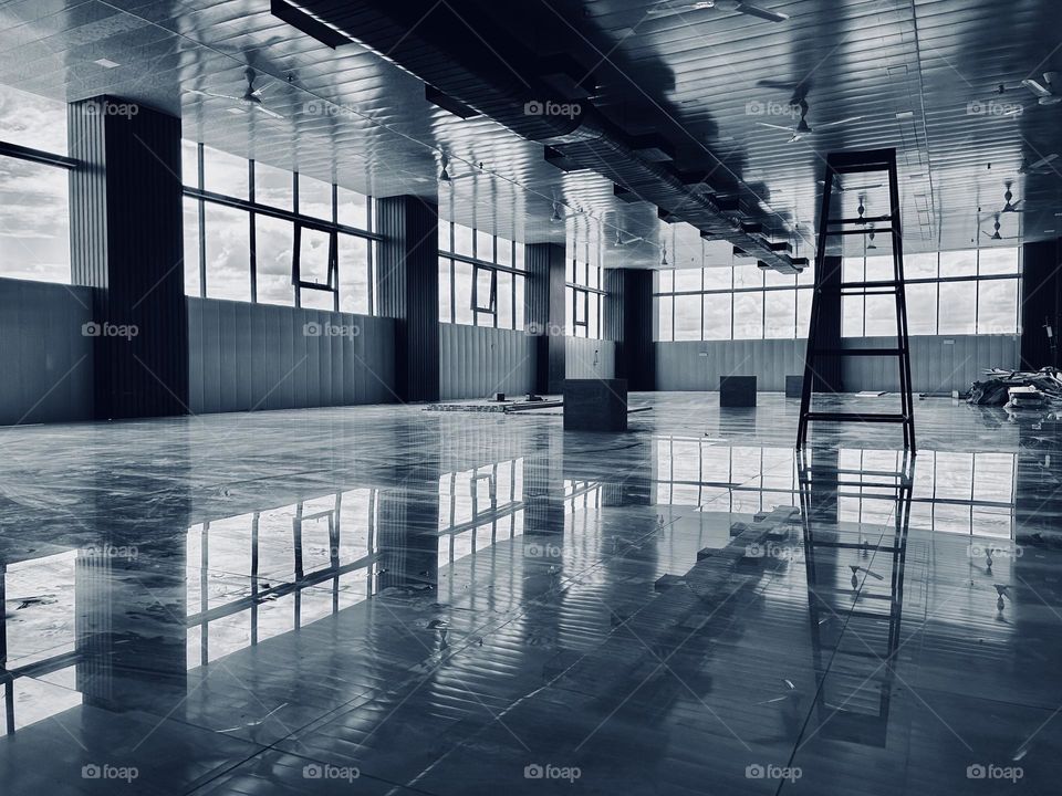 Reflection of windows and ceiling on a construction site 