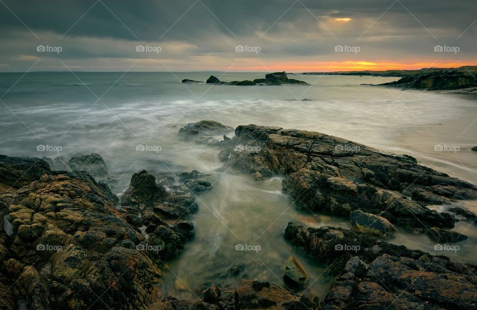 Sunset seascape scenery of rocky coast at wild atlantic way in county Galway, Ireland