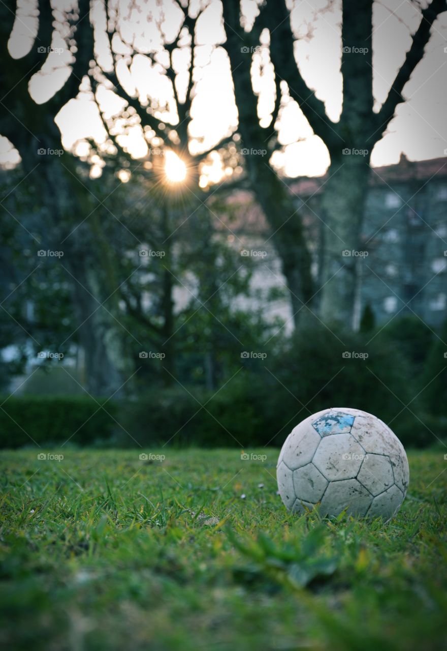 Football on a field seen from a low point of view.