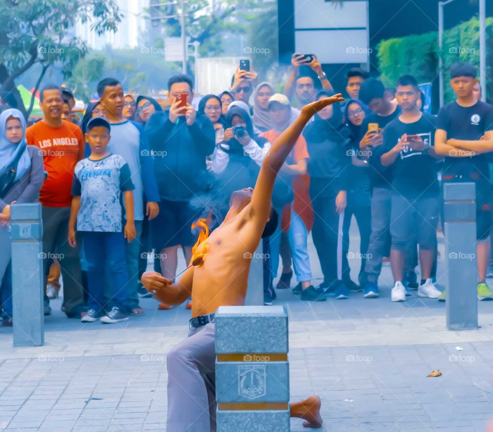 Dancing With Fire - a traditional dancer also known as Reog dancer performed his skill in fire proof. Jakarta, October 27, 2019