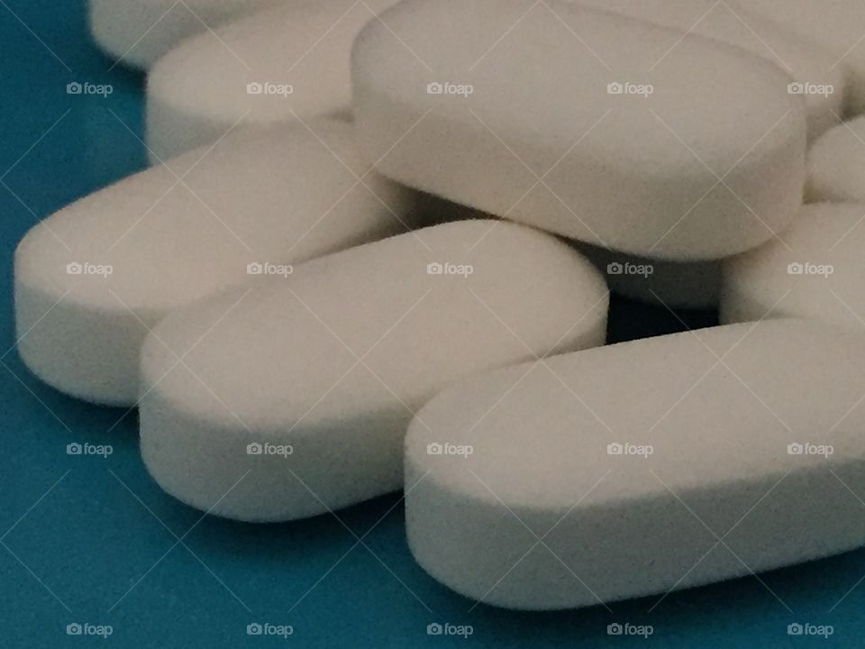 Close-up of white tablet pills.