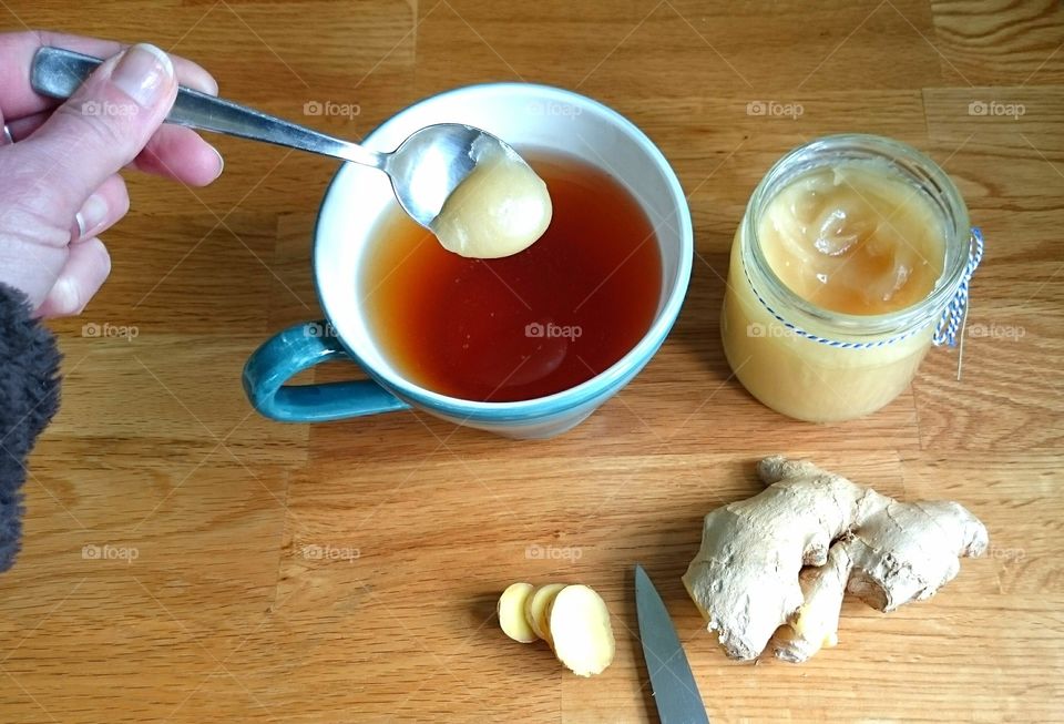 Adding ginger paste in tea