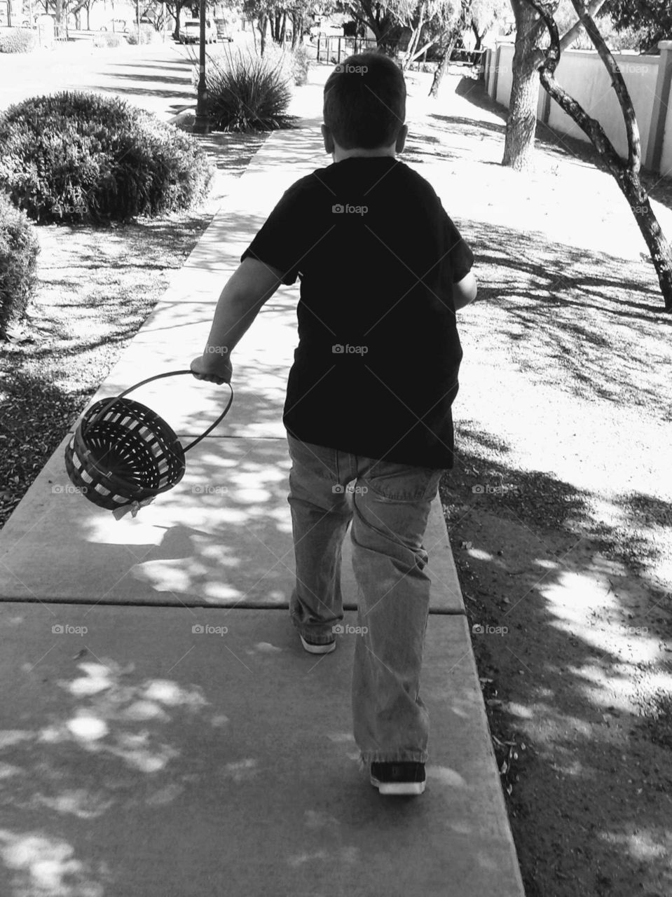 Boy running with basket