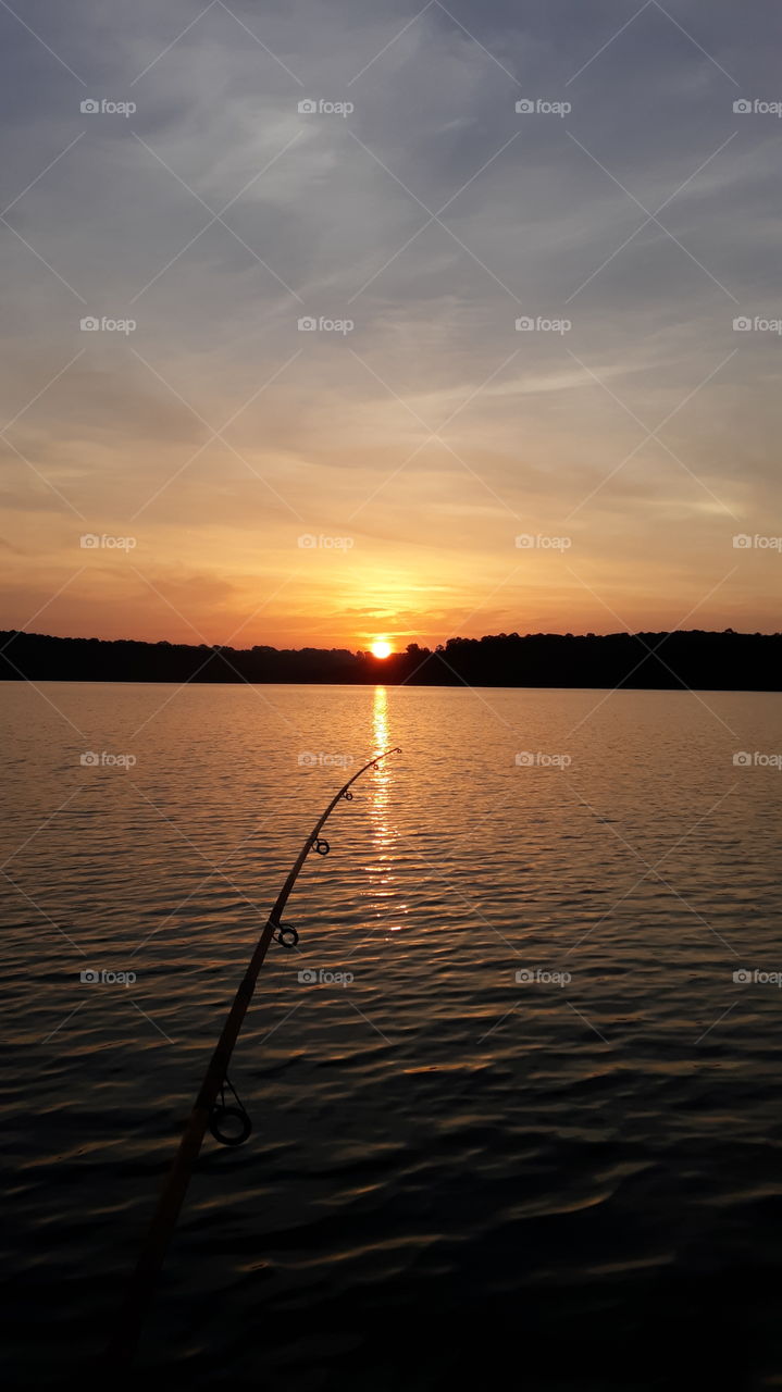 Fishing with a beautiful sunrise on the lake