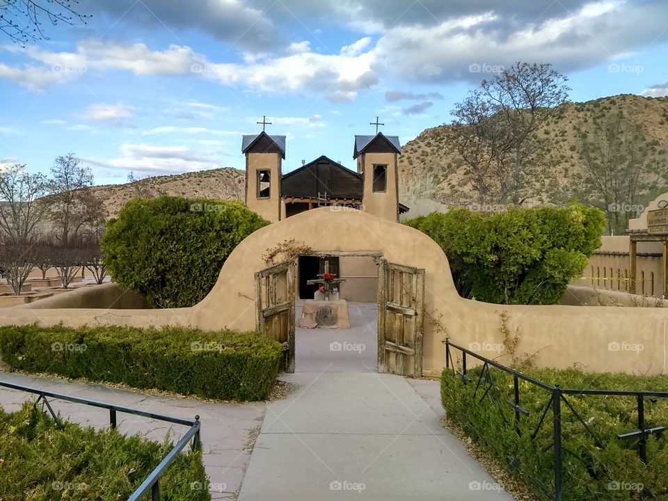 Adobe church capilla in high Desert mountain southwest New Mexico USA
