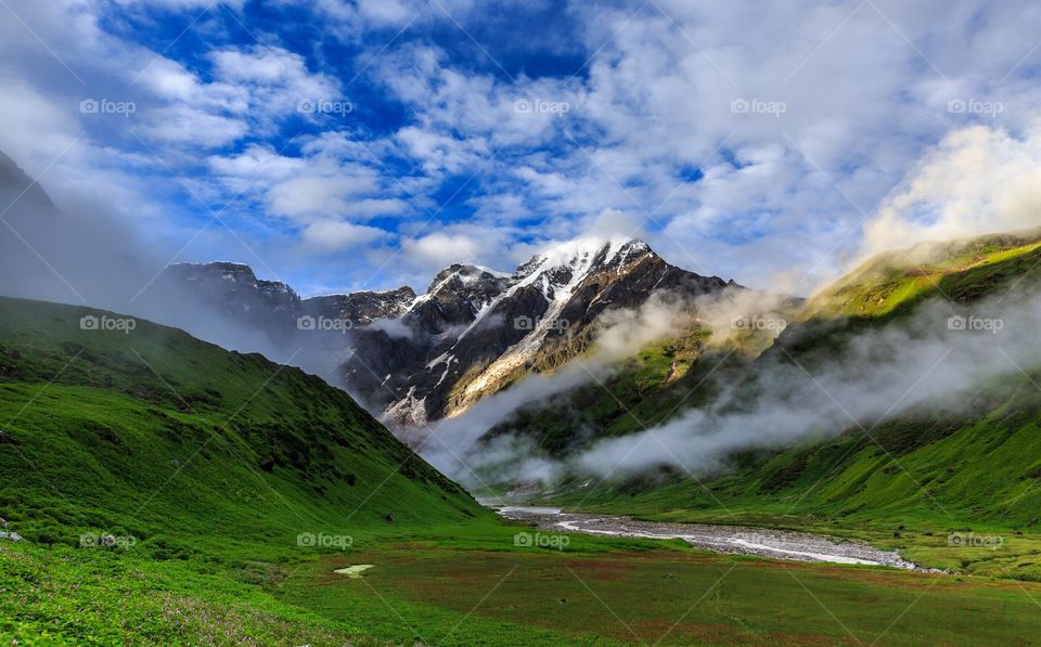 snow capped and foggy , mesmerizing Mandini valley Garhwal, Himachal Pradesh, India