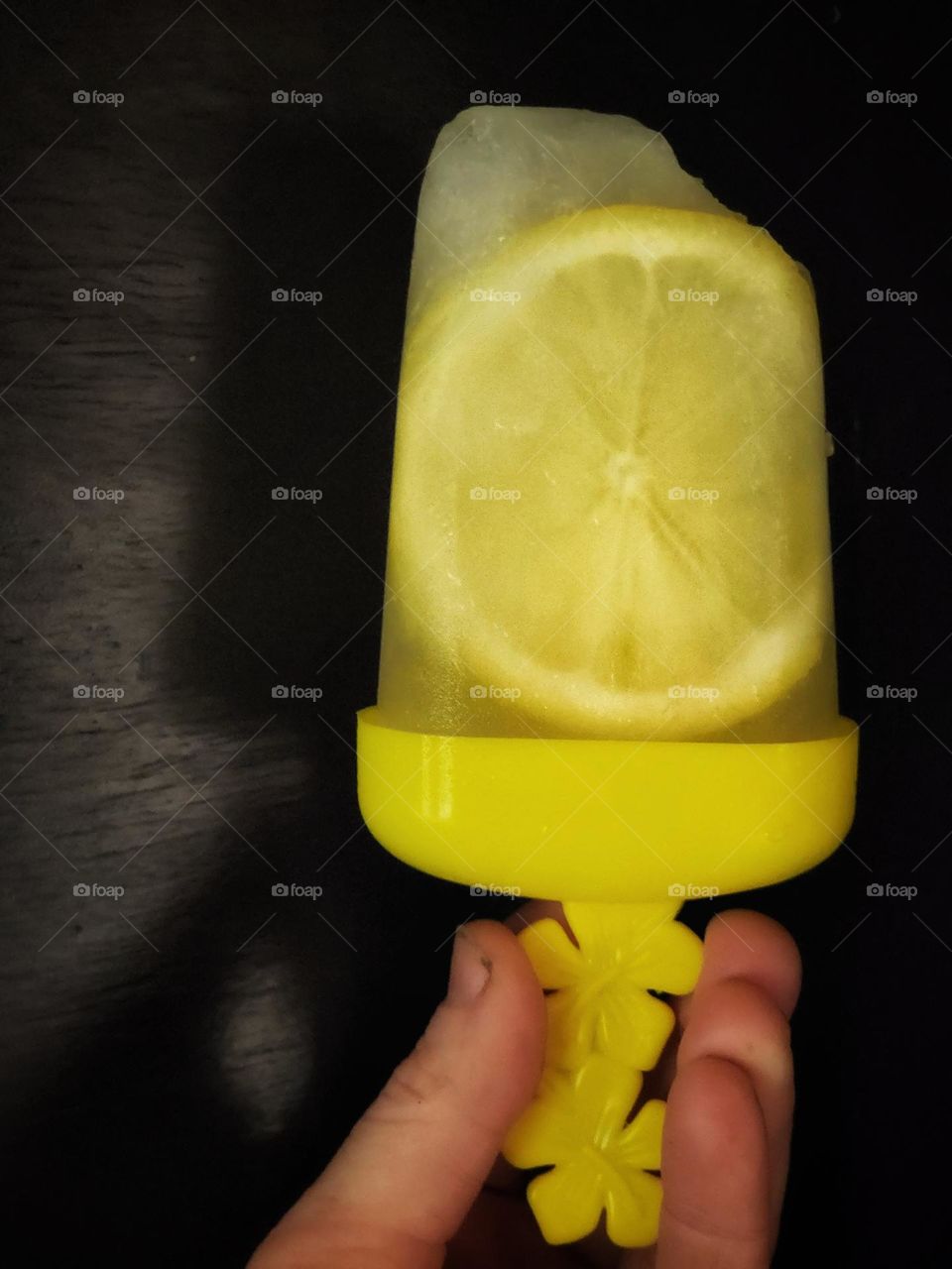 Enjoying a homemade lemonade popsicle.