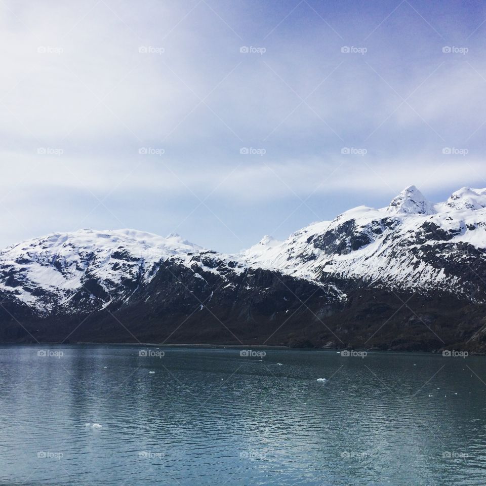 Scenic view of snowcapped mountain and idyllic lake