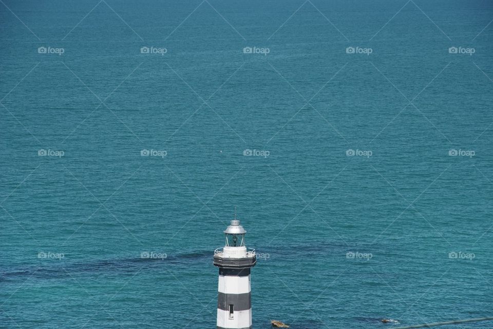 Top of lighthouse with sea background