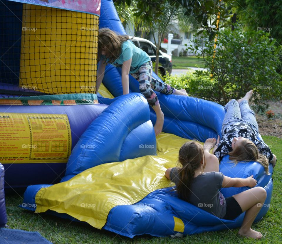 Kids Playing on Bounce House 