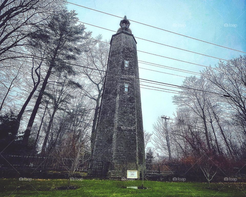 Old windmill on the side of the road missing it’s sails.