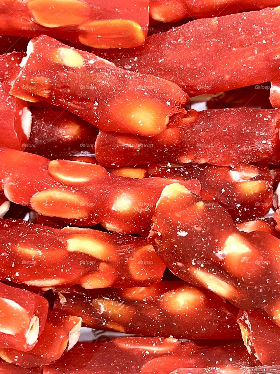 Close-up shot of red oriental sweets with peanuts