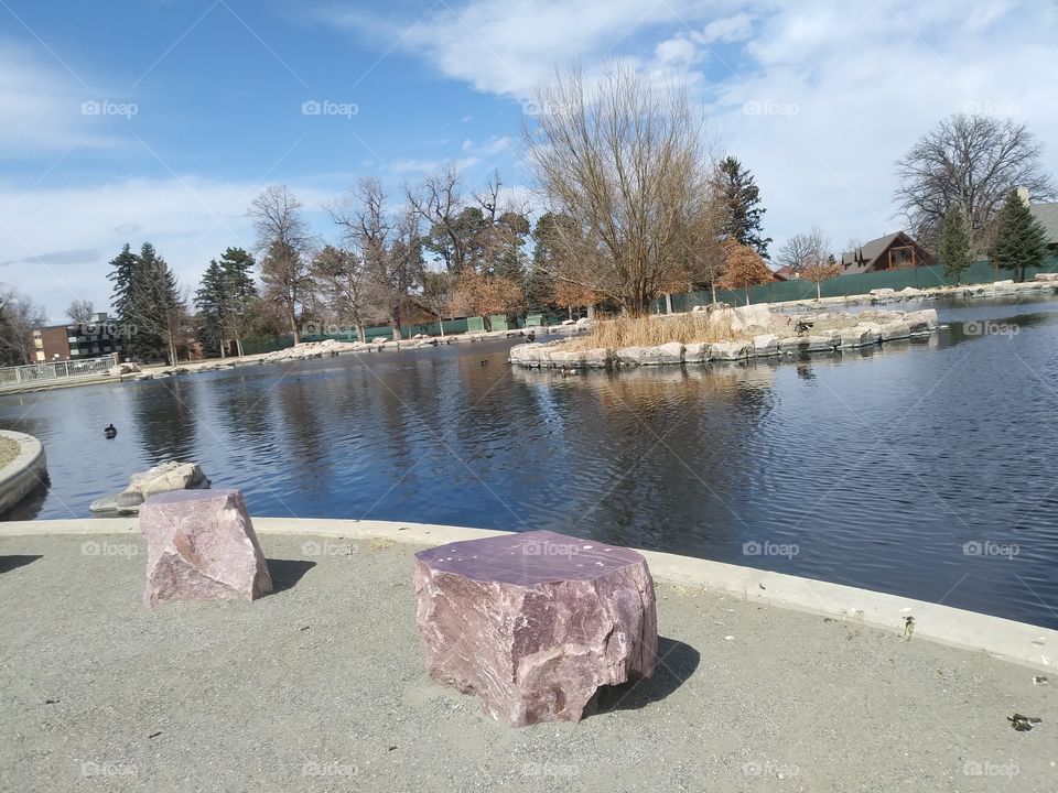This is a picture of General's Park in Aurora, Colorado. It depicts the pond where the ducks and geese swim, with some nice red rocks at the shore.