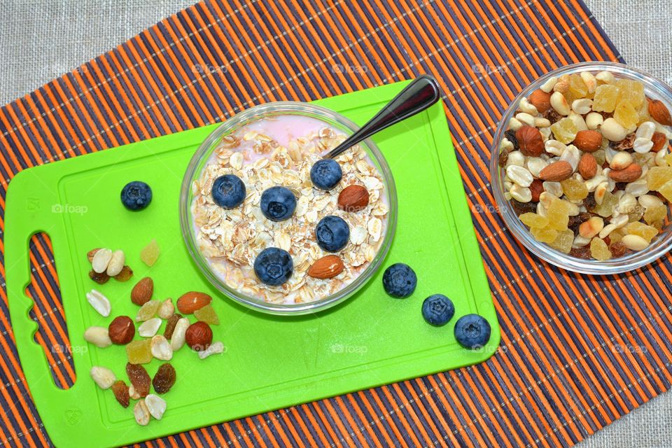 High angle view of breakfast with dried fruits