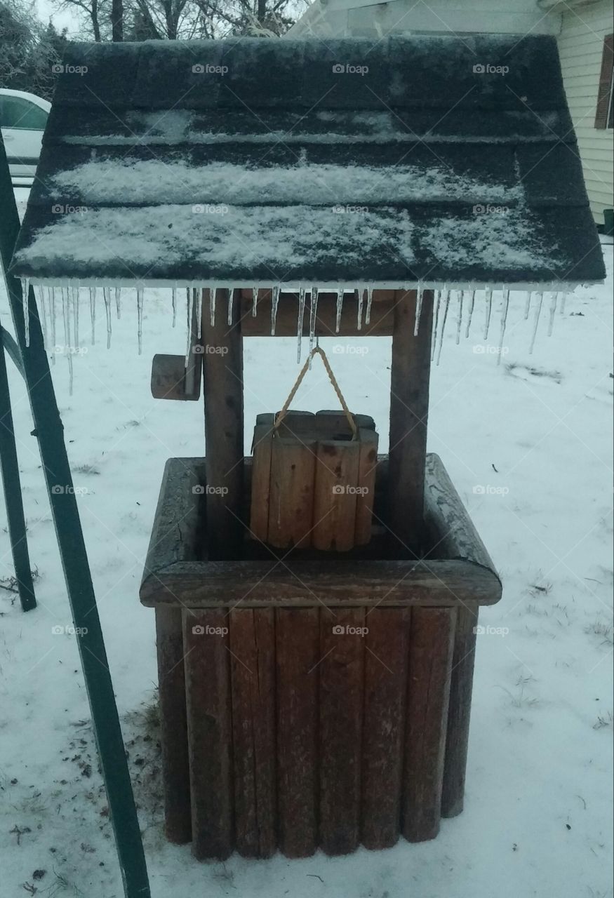wishing well. our wishing well after an ice storm