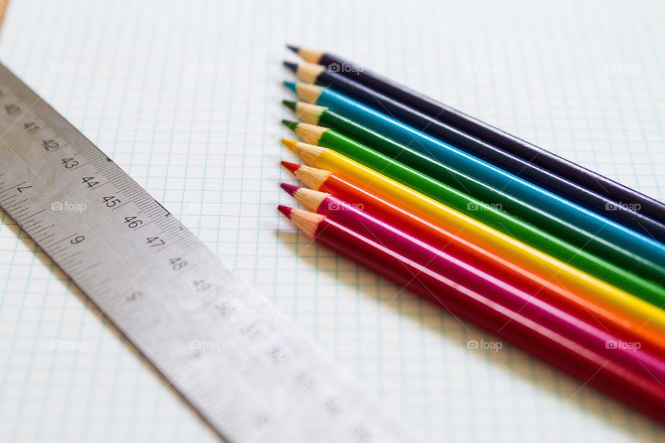 Colored pencils and ruler on graph paper