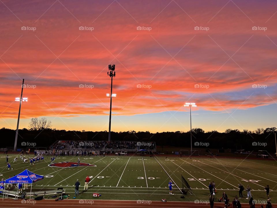 Stunningly beautiful sunset during Friday Night Lights high school football game