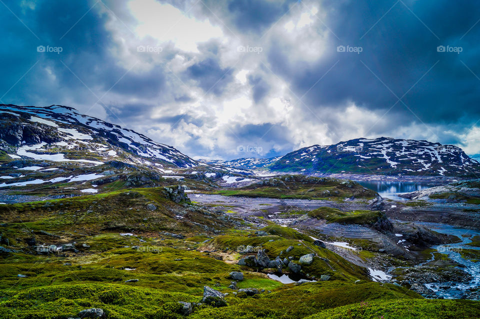 Cloudscape over snowy mountains