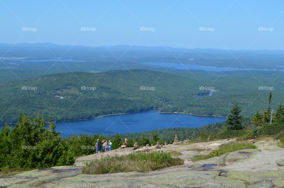 Acadia national park in Maine is the first place in the country to greet the Sun, and it has the tallest mountain on the Northern Atlantic coast with panoramic views of the whole area from it's hiking trails. 