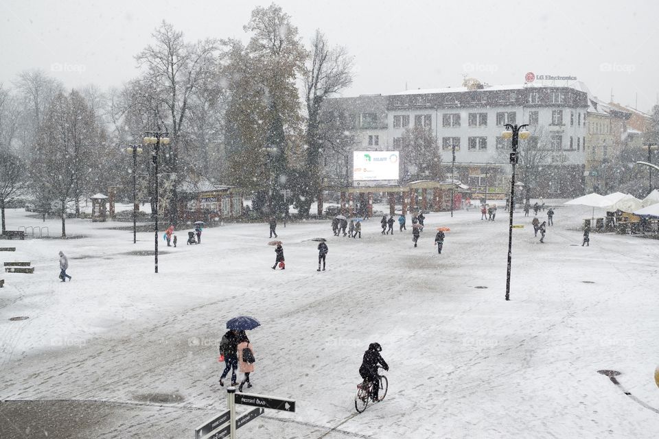 people at town during snowfall