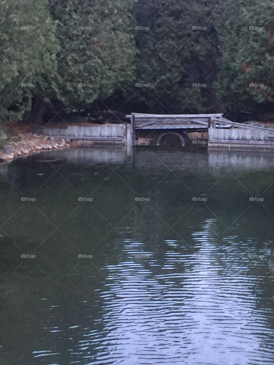 Small pond with a water wheel in the walking bridge so inviting I could picture myself just dipping my toes in the water