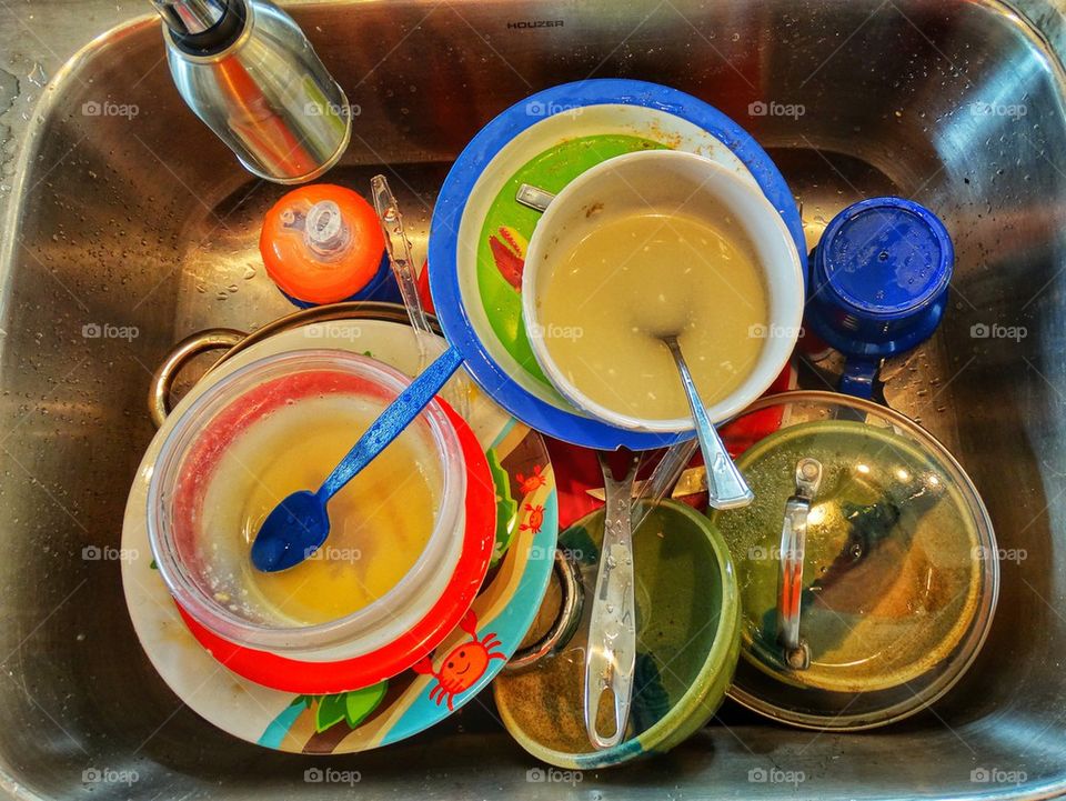 Cleaning Dishes In The Kitchen Sink