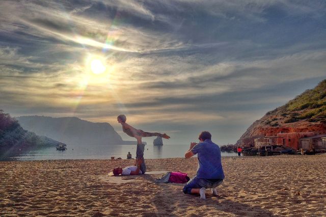 Shot of a shot. Typical Ibiza Sunday. A bit of AcroYoga with a magical sunset and everyone taking pictures!