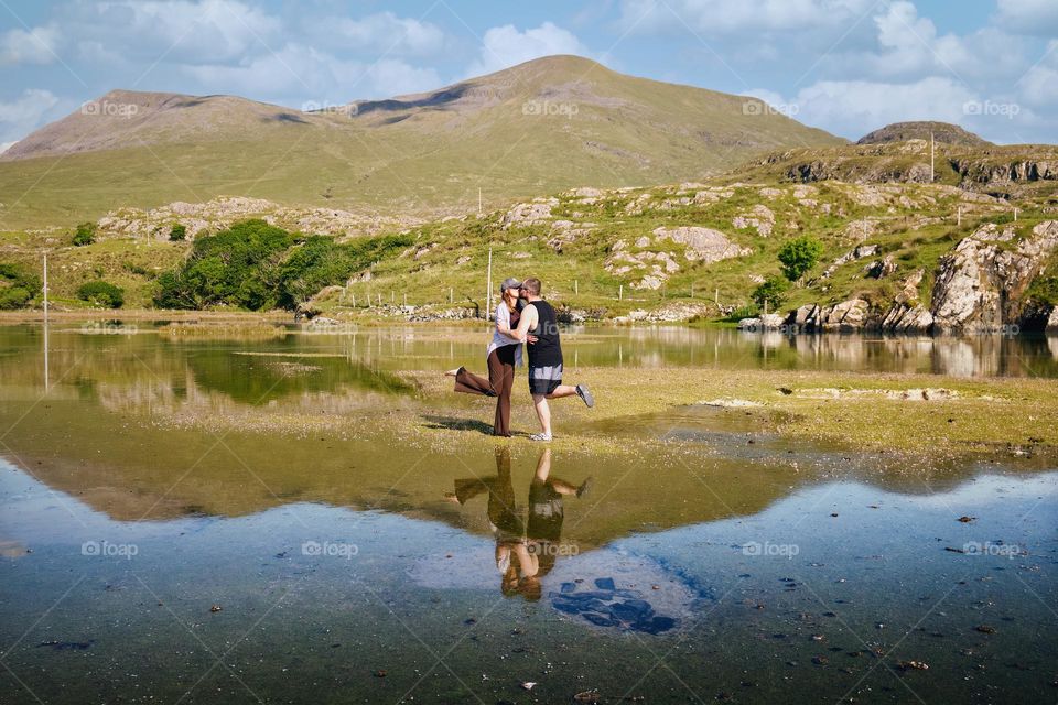 Kiss under mountains at Silverstrand beach