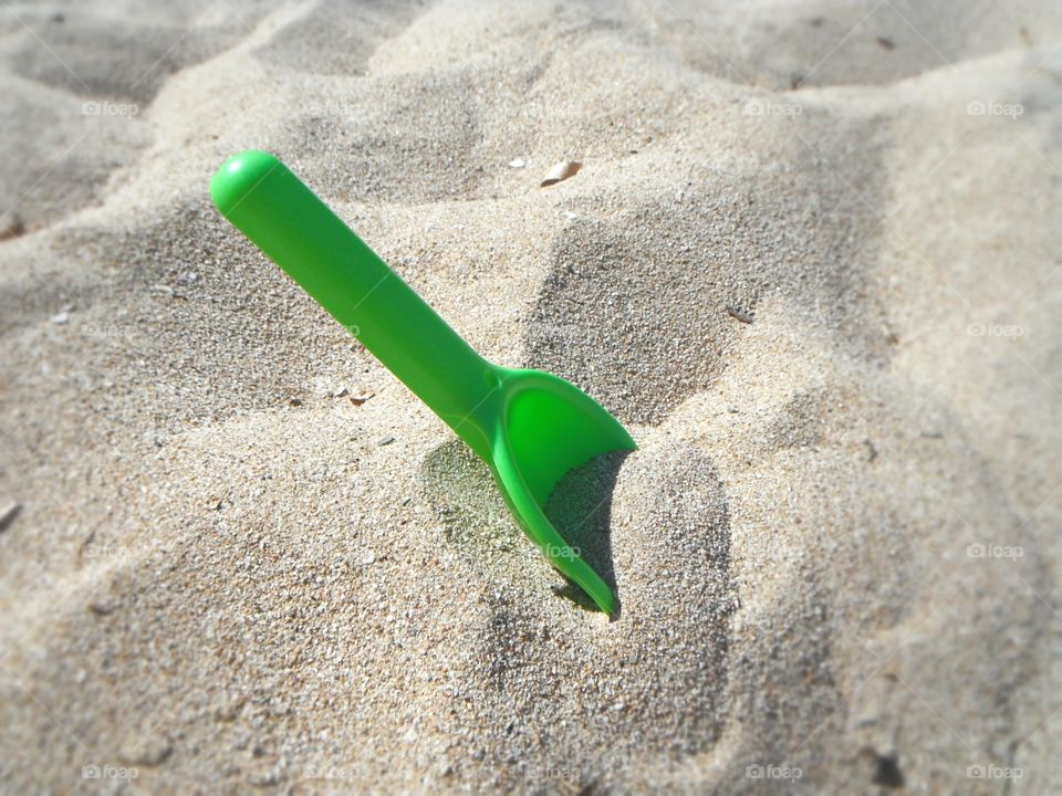 minimalistic snap: toys shovel in the sand