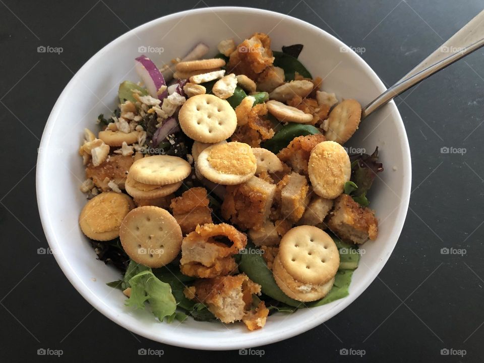 Delicious salad sprinkled with yellow Ritz Bits crackers