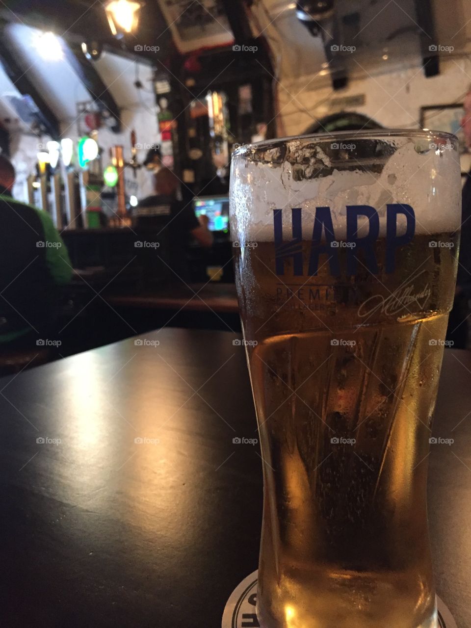 Harp beer on pub table in Belfast Ireland