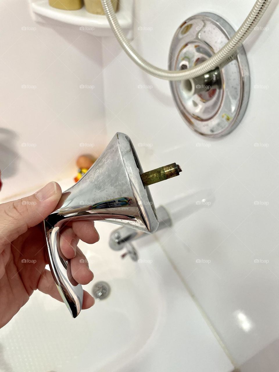 Shower handle breaks off in hand, more plumbing problems, shower handle breaks off, need to call a plumber, plumbing problems, repairs in the home