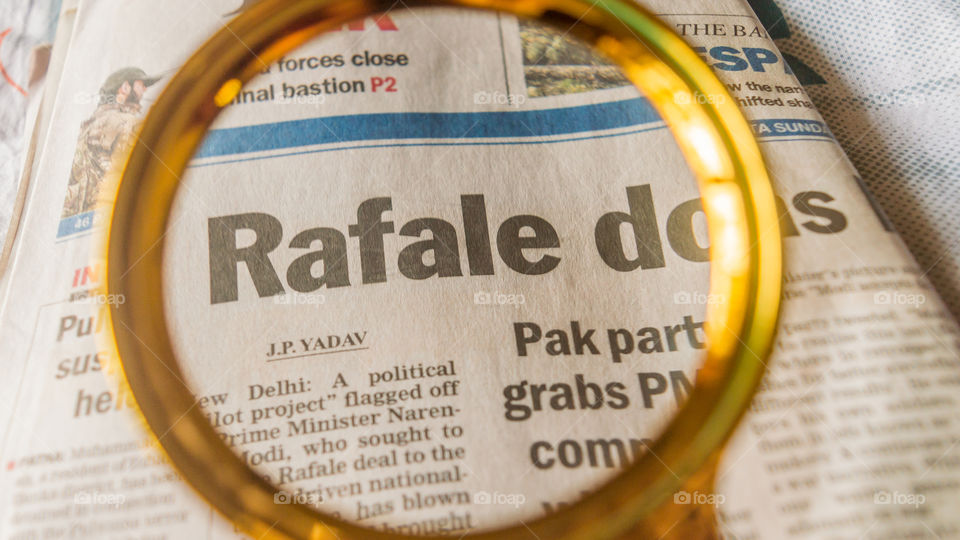 Kolkata, India, 18th March, 2019: The word Rafale under scanner in an english newspaper.