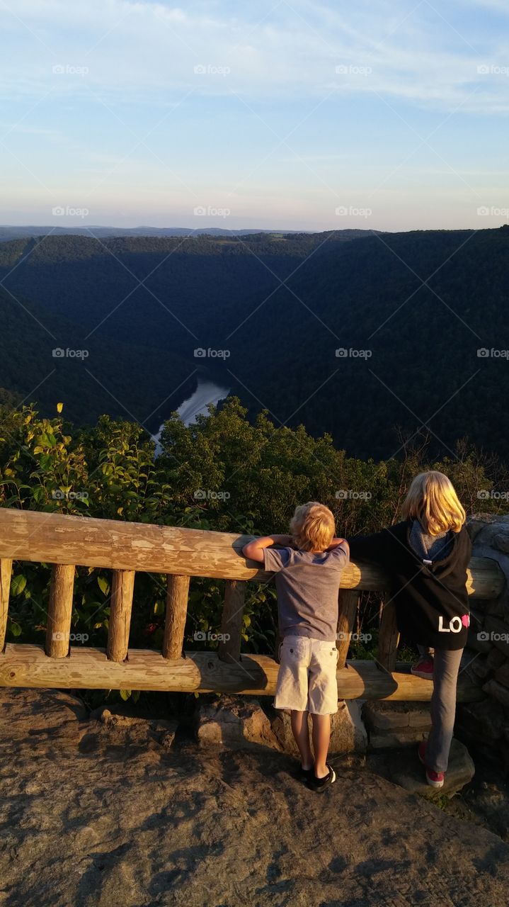 Cooper's Rock Overlook. kids annoying the beauty of the river running through the mountains