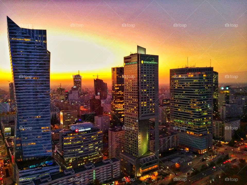 an early autumn sunset in Warsaw through the aerial view of city skyline