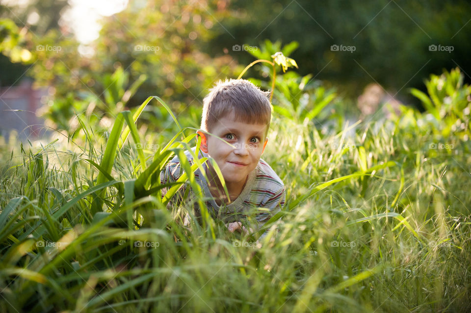 boy play in the grass