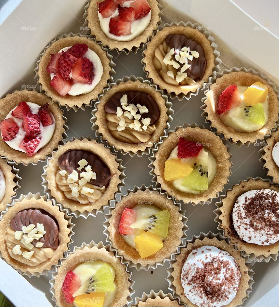 Assorted homebaked Fruit tarts and Nutella chocolate nut butter tarts 