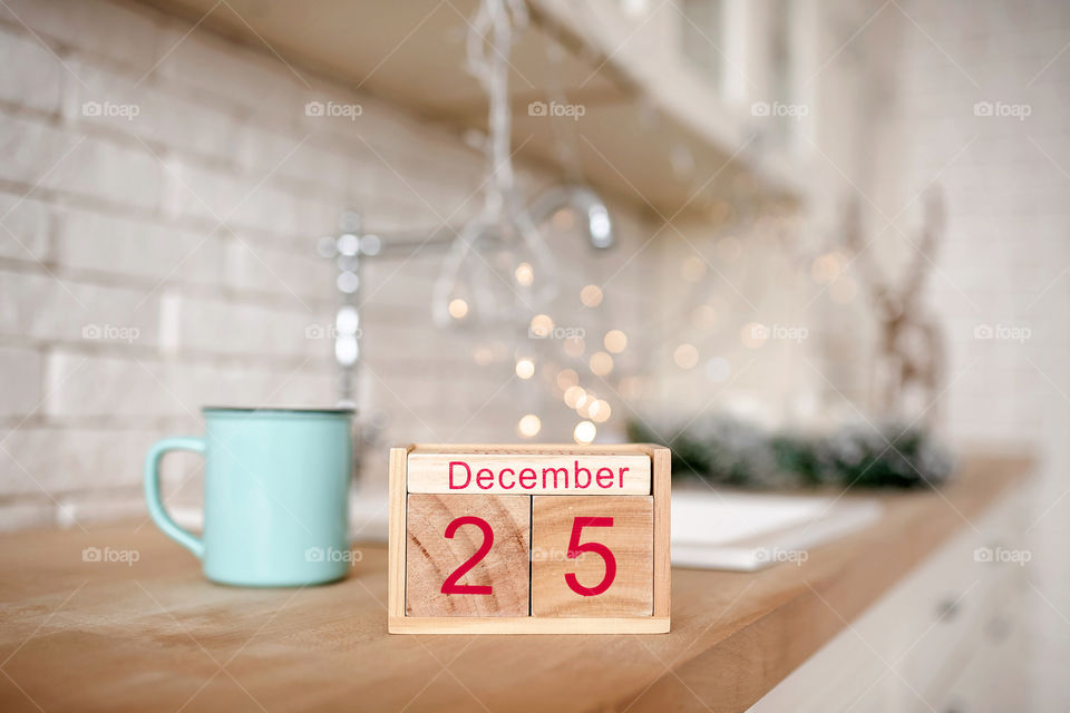 Christmas background with wooden block calendar with the date of December 25