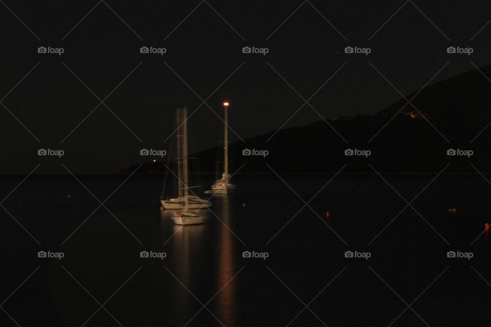 Boats at the  sea at night