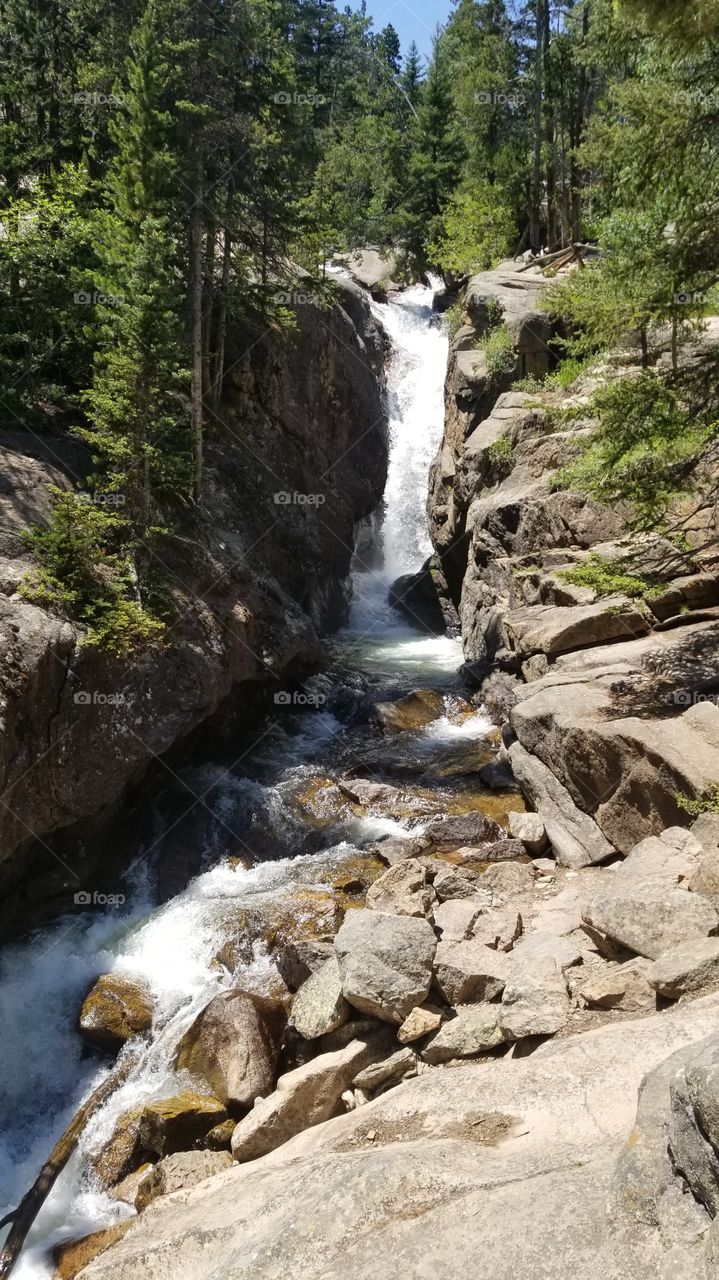 Roaring waterfall inside Rocky Mountain National Park. What an incredible sight!