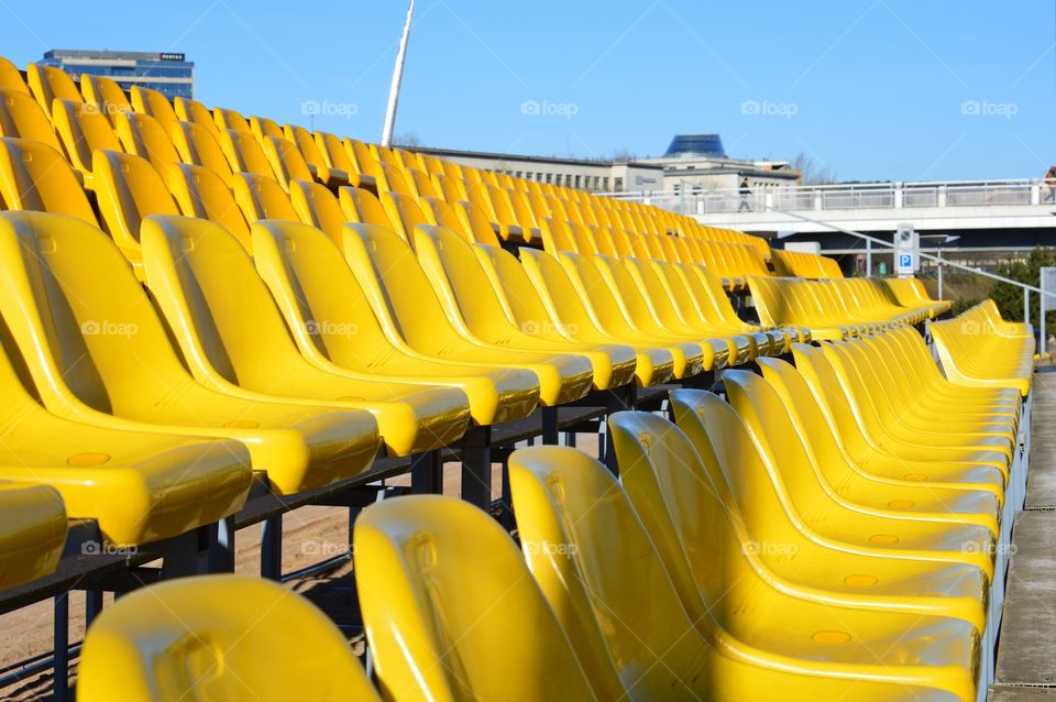 Yellow seats at sunny day