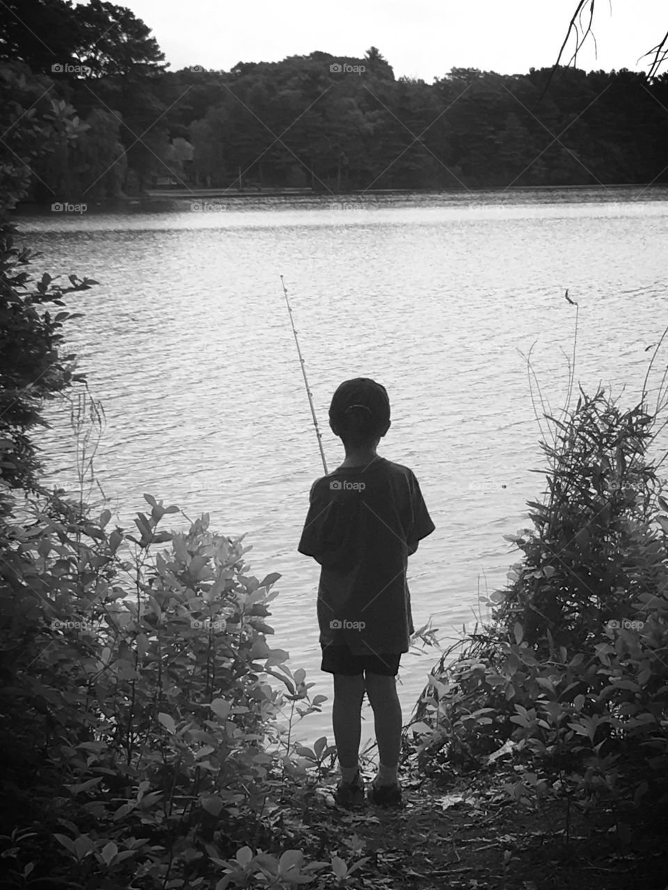 My nephews first fishing derby.  His first cast in and he caught a fish!  He looked so content just standing there with his rod. 