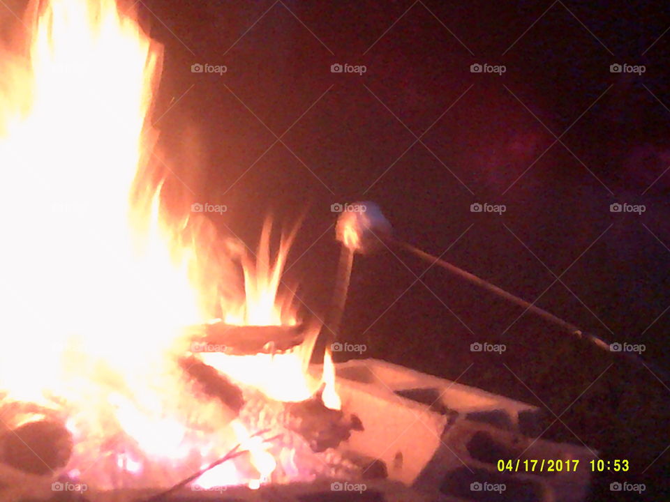 roasting marshmallows on hot summer night