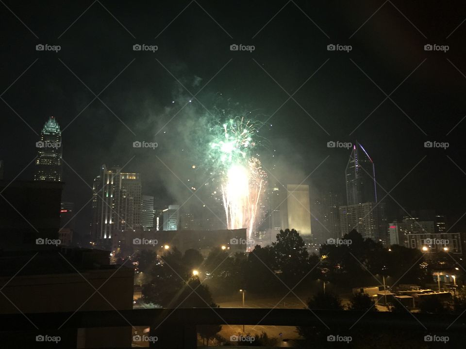 Fourth of July fireworks in downtown Charlotte North Carolina, the queen city extravaganza, fireworks display, pyrotechnic Lighting up the city skyline, cityscape, July 4, independence day celebration, holiday, partying