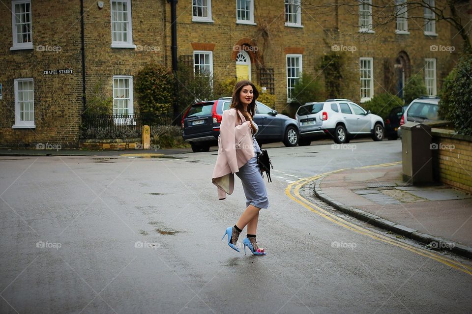 stylish woman crossing the road