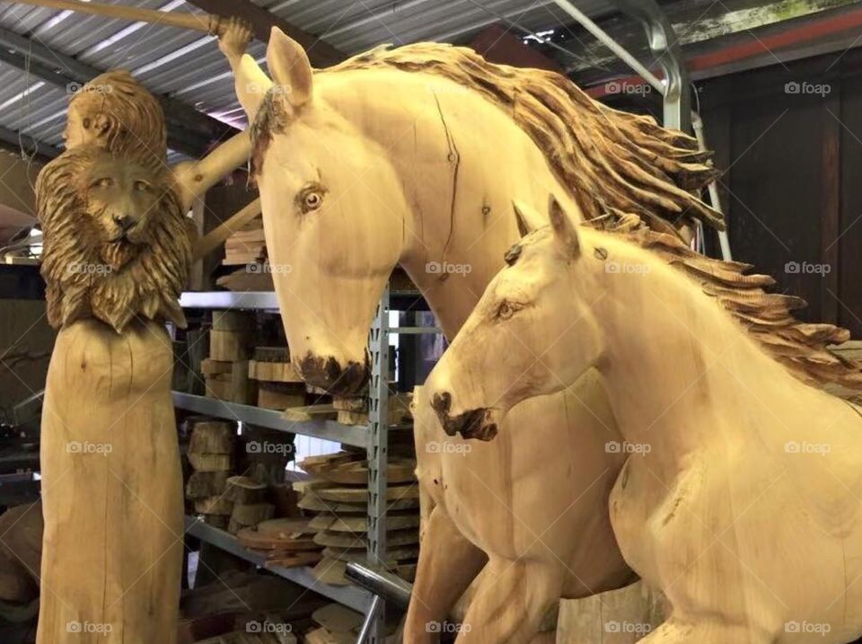 Large wood carvings located at a wood carvers shop , in Great Smoky Mountains Tennessee . 